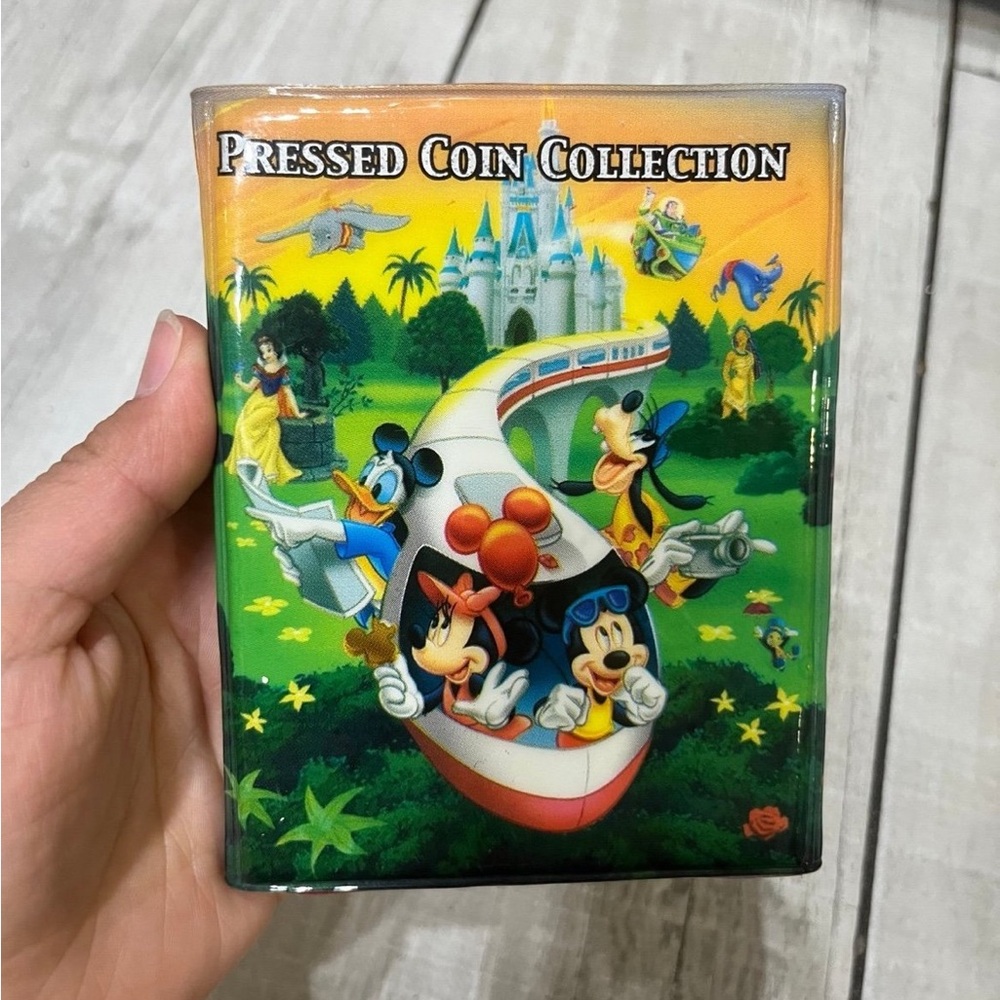 Walt Disney World Pressed Coin Collection Book With 27 Some Pressed Coins